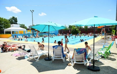 Guests enjoy the new lounge chairs and bright new colors at Douglass and DeGraw Pool in Brooklyn.